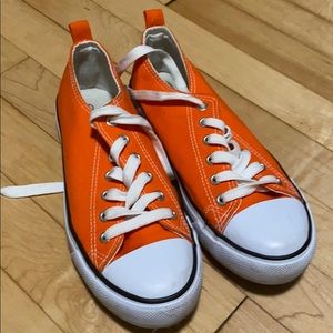 Orange tennis shoes